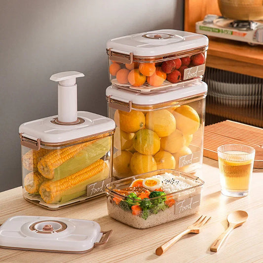 Set of food storage containers with fruits and vegetables on a kitchen counter.