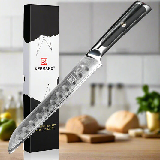 Serrated kitchen knife with KEEMAKE packaging on a white background