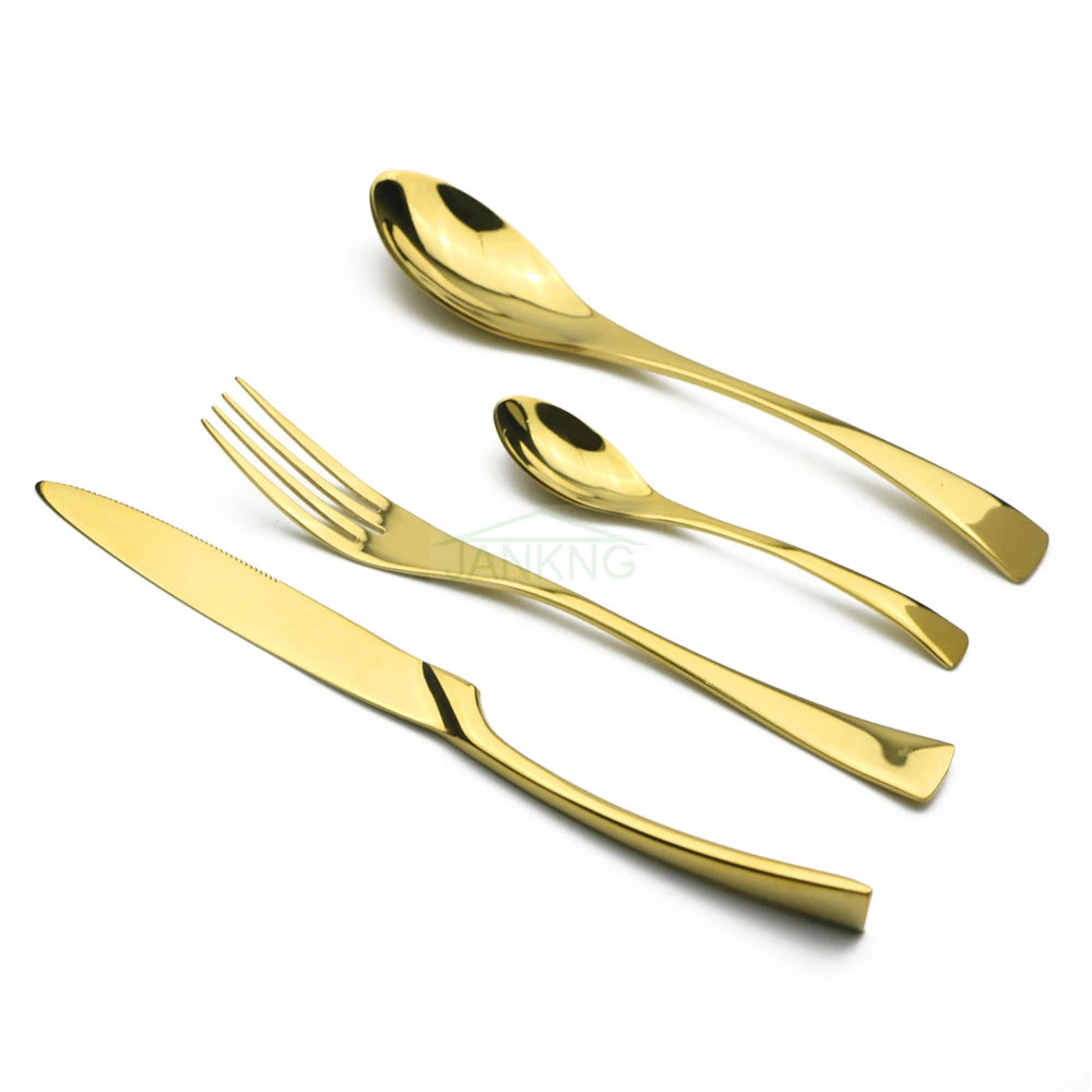 Set of gold cutlery including a knife, fork, and two spoons on a white background.