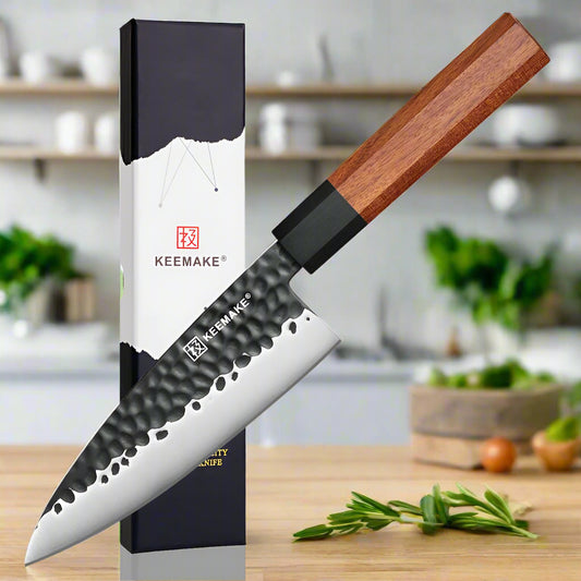 Serrated knife with wooden handle and branded packaging on a white background