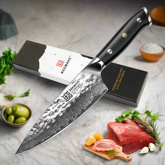 Keemake chef's knife with packaging and ingredients on a white background