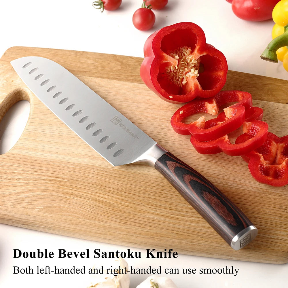 Double bevel Santoku knife on a wooden cutting board with sliced red bell pepper and vegetables.
