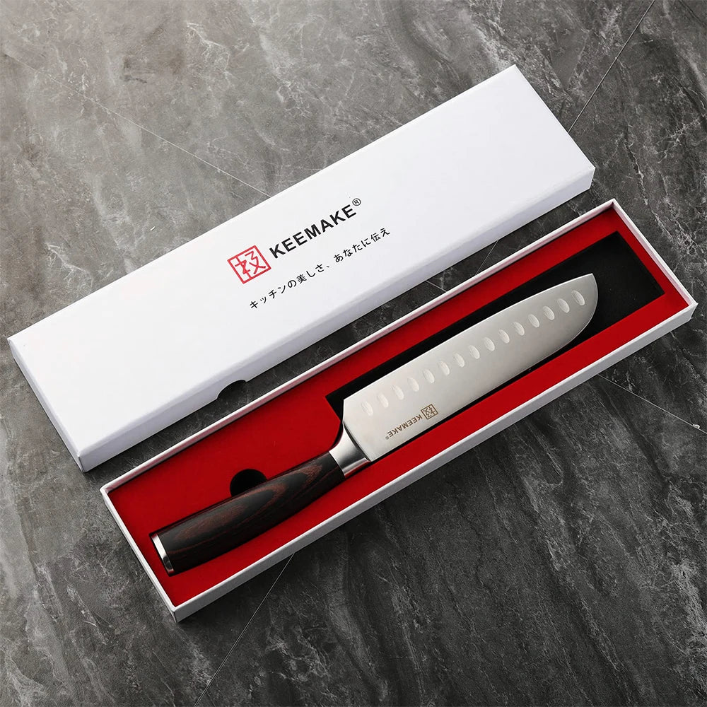 Serrated knife in a KEEMAKE box on a gray marble background