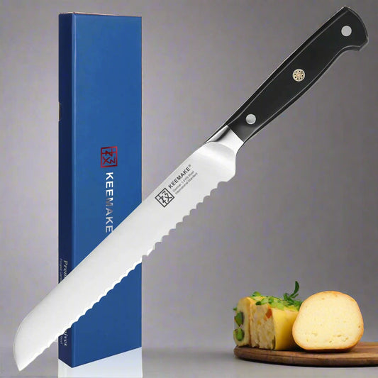 Knife with black handle and white blade next to a blue KEEMAKE box on a white background