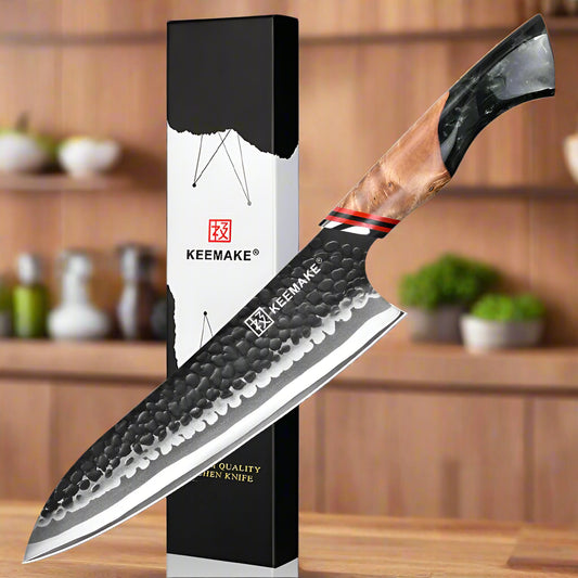Chef's knife with wooden handle and KEEMAKE branding on a white background