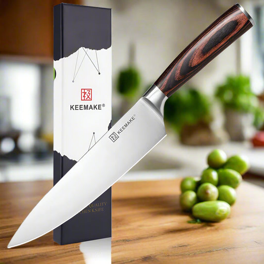 Keemake chef's knife with wooden handle and branded packaging on a white background