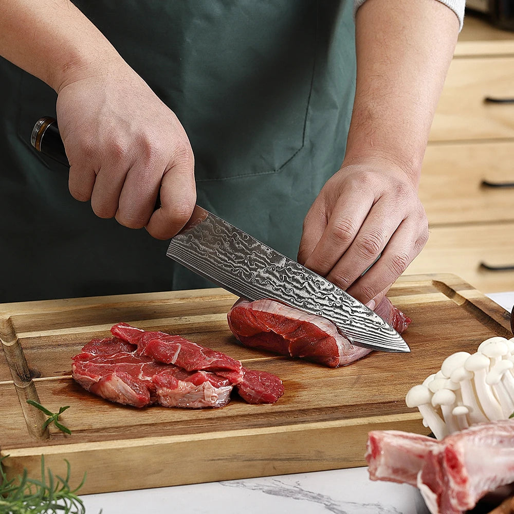 Person cutting raw meat on a wooden board with a chef's knife.