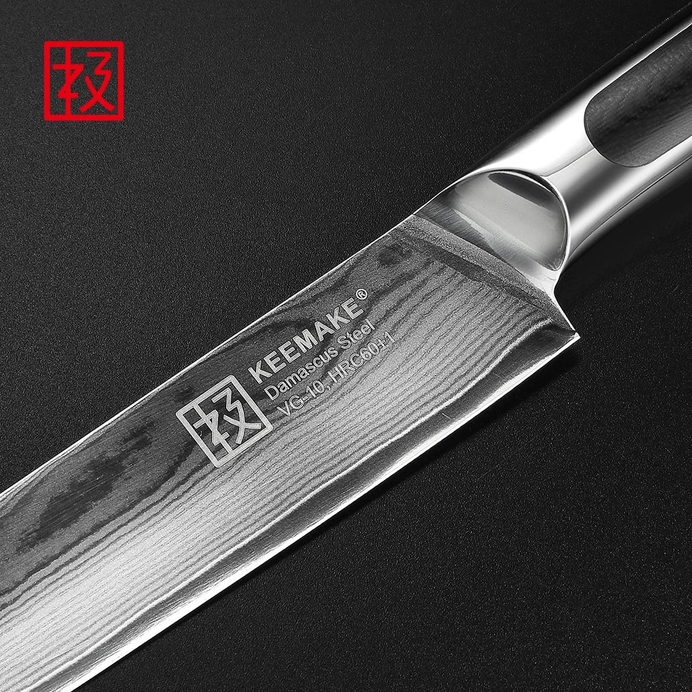 KEMAKE kitchen knife with Damascus steel blade on a black background