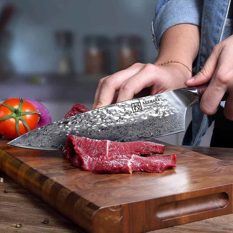 Person cutting raw meat on a wooden board with a Keimeke knife.