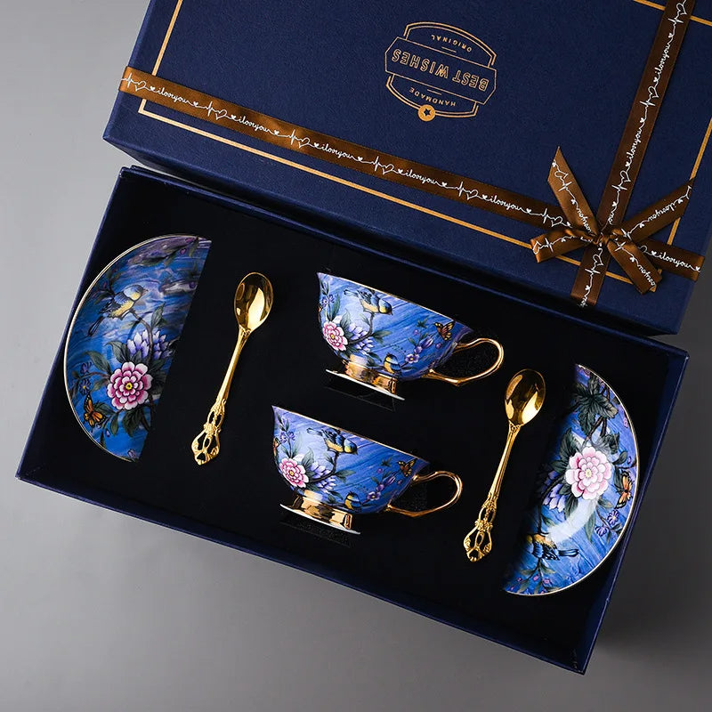 Tea set with floral designs in a decorative box, featuring a visible brand logo.