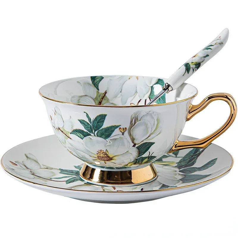 Ceramic tea cup with floral design and gold accents on a white background