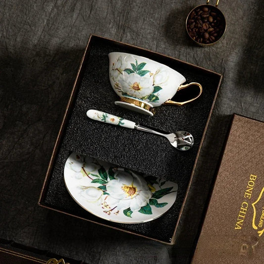 Teacup and saucer set with floral design in a decorative box, featuring the brand 'Bone China'.