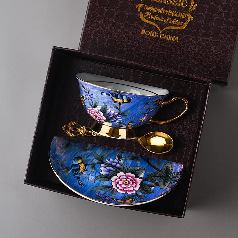 Blue floral teacup and saucer set with gold accents in a decorative box.