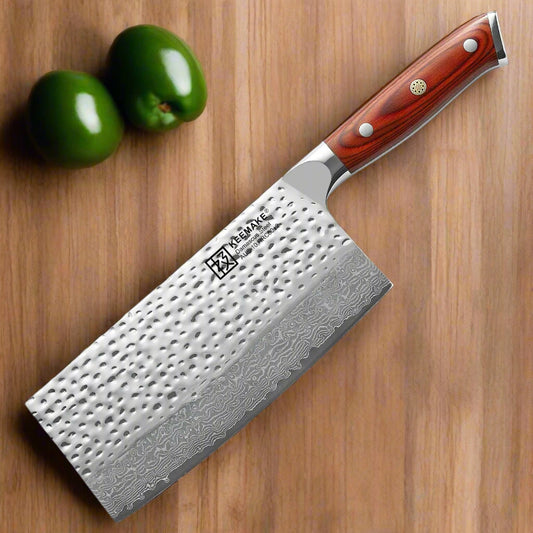 Chef's knife with a red handle on a white background